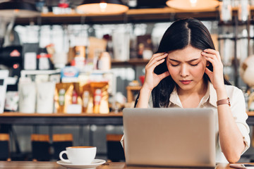 Freelance business woman working with laptop computer he was stressed out with job failing bankruptcy