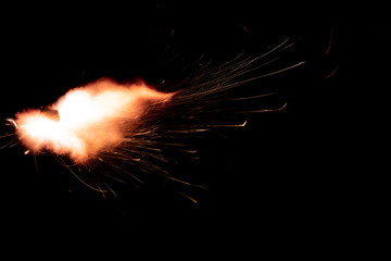 Wall Mural - the texture of a shot from a firearm on a black background, the output of gunpowder gases from the barrel of a rifle and a pistol
