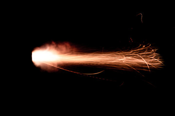 Wall Mural - the texture of a shot from a firearm on a black background, the output of gunpowder gases from the barrel of a rifle and a pistol
