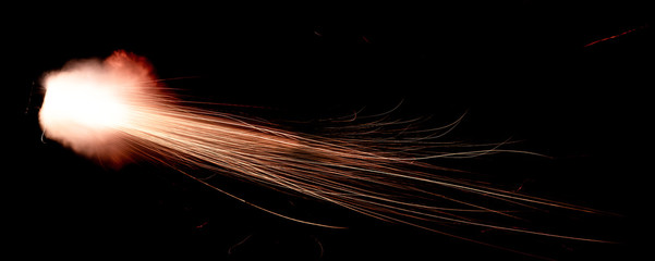 Wall Mural - the texture of a shot from a firearm on a black background, the output of gunpowder gases from the barrel of a rifle and a pistol