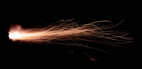 Wall Mural - the texture of a shot from a firearm on a black background, the output of gunpowder gases from the barrel of a rifle and a pistol