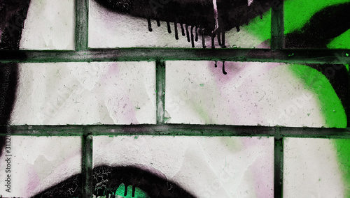 White brick wall painted with acrylic multicolored paint for background