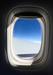 © Phuong - Airplane window with blue sky background