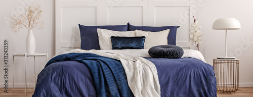 Stylish White Lamp On Trendy Bedside Table In Classy Navy Bedroom Interior Buy This Stock Photo And Explore Similar Images At Adobe Stock Adobe Stock