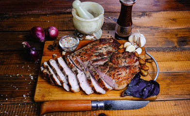 roasted ham composition on a wooden background