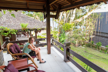 Beautiful tourist at tropical destination Tuktuk, on the island Samosir in Lake Toba, Sumatra, Indonesia