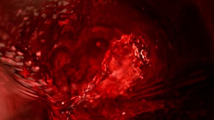 Fototapete - Super slow motion of pouring red wine in twister shape. Filmed on high speed cinema camera, 1000 fps.