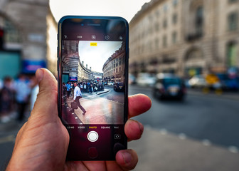 Poster - Taking photos on smartphone of London street