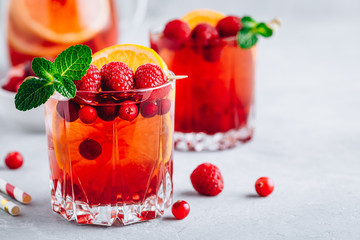 Sticker - Raspberry Cranberry Sangria Punch or Mojito in glass with orange slices and mint