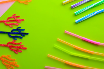 Plastic cocktail straws on color background