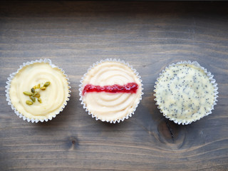 Close up of three diffrent colorful cupcakes