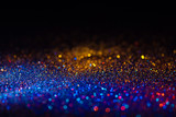 Fototapeta Tęcza - Multicolored shining glitter in focus and out of focus, abstract shiny background