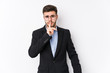 © Asier - Young caucasian business man posing in a white background isolated Young caucasian business man keeping a secret or asking for silence.
