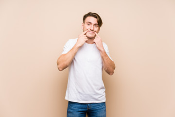 Young caucasian man posing isolated doubting between two options.