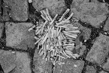 Altenburg / Germany - January 2020: Ashes And Paper Remains Of A Firecracker Battery On The Pavement On New Year’s Afternoon