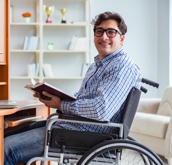 Wall Mural - The disabled student studying at home on wheelchair