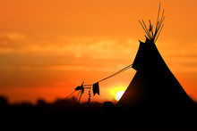 An American Indian Tipi (teepee) Against An Evening Sunset.