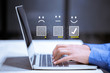 © A Stockphoto - Business customer pressing smiley face emoticon online, Service rating, satisfaction concept.