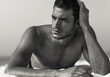 © PKpix - Sexy portrait of handsome topless male model on the beach. Black and White.