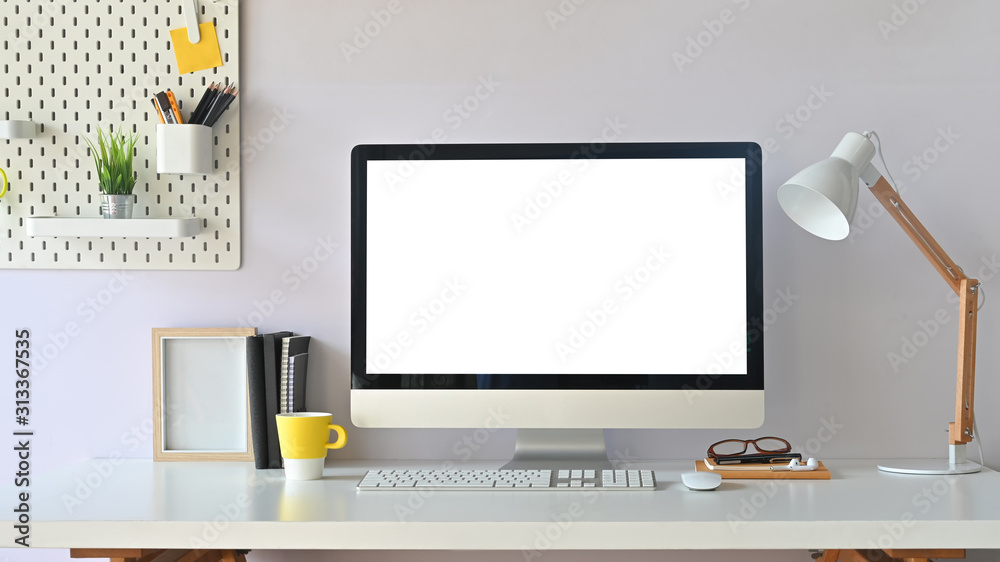 Workspace computer mockup and office supplies with peg board on wooden table. - obrazy, fototapety, plakaty 