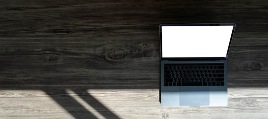 Poster - businessman using laptop at home Laptop with blank screen on table  notebook space