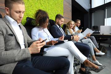 Wall Mural - Stressful modern people waiting for job interview.