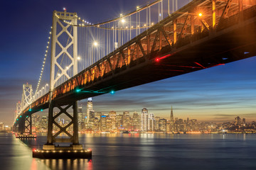 Canvas Print - Western Span of San Francisco-Oakland Bay Bridge and San Francisco Waterfront in Blue Hour. Shot from Yerba Buena Island, San Francisco, California, USA.