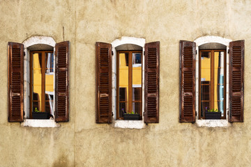 Windows and wall in old city.