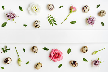 Wall Mural - Creative layout floral pattern with quail eggs on white background. Easter minimal concept, copy space