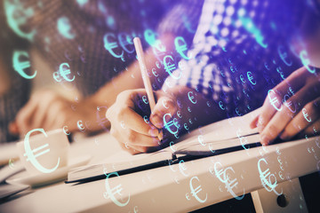 Multi exposure of two men planing investment with stock market forex chart.