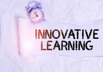 Poster - Handwriting text writing Innovative Learning. Conceptual photo Interdisciplinary teaching that stirs analytic thinking Alarm clock and torn cardboard placed above plain pastel table backdrop