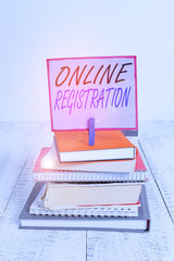 Poster - Word writing text Online Registration. Business photo showcasing registering via the Internet as a user of a product pile stacked books notebook pin clothespin colored reminder white wooden