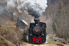 Steam Train Puffing Along The Tracks