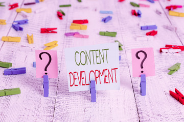 Fototapete - Text sign showing Content Development. Business photo showcasing Authoring and originating content for any medium Scribbled and crumbling sheet with paper clips placed on the wooden table
