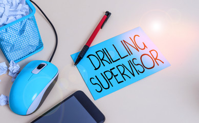 Poster - Conceptual hand writing showing Drilling Supervisor. Concept meaning in charge of commercial oil drilling work and process crumpled paper in bin placed next to modern gadget and stationary