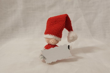 Wall Mural - small santa claus crochet puppet