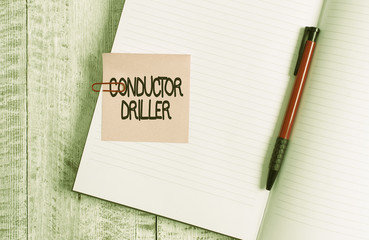Poster - Word writing text Conductor Driller. Business photo showcasing means of conveying the upflowing drilling fluid Thick pages notebook stationary placed above classic look wooden backdrop