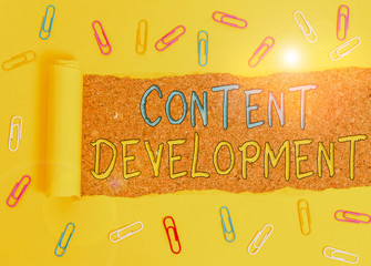 Fototapete - Text sign showing Content Development. Business photo text Authoring and originating content for any medium Paper clip and torn cardboard placed above a wooden classic table backdrop