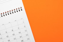Close Up Of Calendar On The Orange Table, Planning For Business Meeting Or Travel Planning Concept