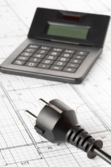 Wall Mural - power cord, plug and calculator on building construction blueprint plan - energy saving or power con