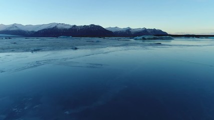 Wall Mural - Flying over seals on a glacier ice sheet lagoon in Iceland