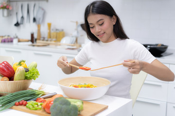 Wall Mural - Eat healthy food for good wellness health concept. Woman cooking salad menu with fresh organic vegetables