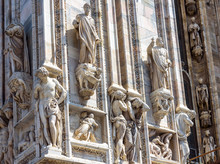 Milan Cathedral (Duomo Di Milano) Close-up, Milan, Italy. Detail Of Luxury Facade With Many Marble Statues And Reliefs.