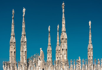 Wall Mural - Milan Cathedral roof, Italy. Famous Milan Cathedral or Duomo di Milano is top tourist attraction of Milan.