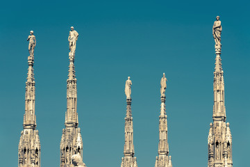 Wall Mural - Milan Cathedral roof, Italy. Famous Milan Cathedral or Duomo di Milano is a top tourist attraction of Milan.