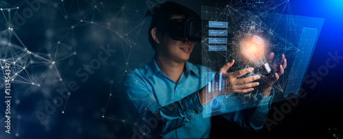 Fotomural young asian technician man working and hand touch effect of magic from Virtual r