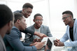 © ASDF - business team discussing documents at working meeting.