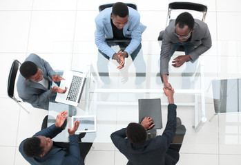 top view. business handshake at an office meeting.