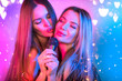 © Subbotina Anna - Singing Women with Microphone, party, Karaoke bar. Beauty Glamour girl friends singing and dancing on Stage. Rock singers, music concert over colorful lights background. Song. Pop music