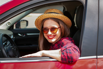 Wall Mural - Young woman driving a modern car